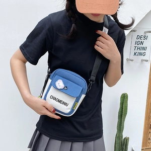 Blue and white canvas messenger bag for students with adjustable shoulder strap and flap