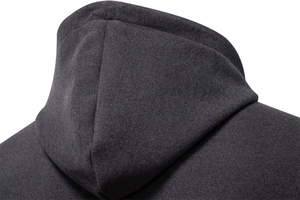 Macro detail of dark grey hoodie showing premium cotton texture and shoulder stitching