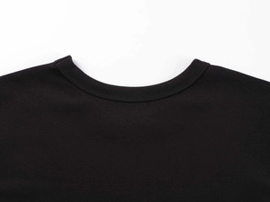 Close-up of a black crew neck modal sports t-shirt showing high-quality neckline stitching