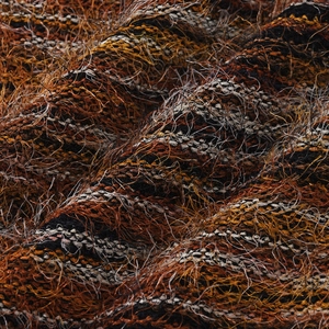 Macro detail of multi-colored mixed knit fabric with soft feather yarn texture and fringe