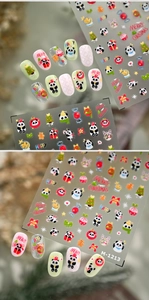 Detail of Christmas nail art stickers featuring panda, gingerbread man and tree patterns