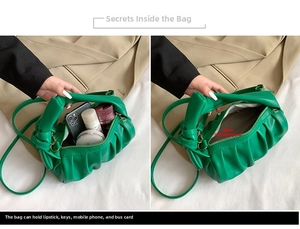 Detail view of the green ruched cloud bag interior compartment and soft PU leather handle