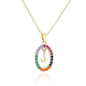 Macro shot of 18k gold plated necklace with rainbow zircon J letter pendant detail