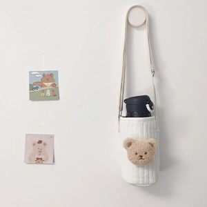 Quilted white cotton water bottle bag with plush bear head and adjustable strap