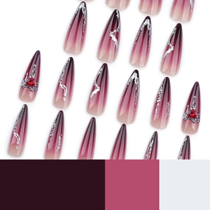 Long stiletto press-on nails with dark burgundy gradient and rhinestone heart accents