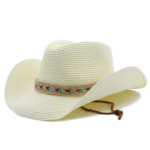 Detail of western straw hat featuring bohemian rainbow woven band and brown chin strap