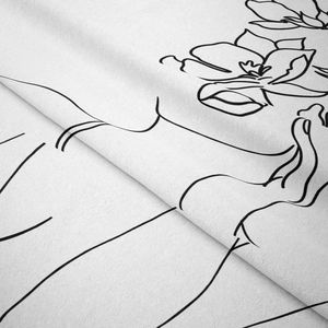 Detailed macro view of minimalist line art print on textured white fabric wall tapestry
