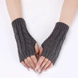 Close-up of dark grey cable knit fingerless gloves with soft wool texture for warmth