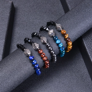 Men's natural tiger eye beaded bracelets set with stainless steel accents on black roll