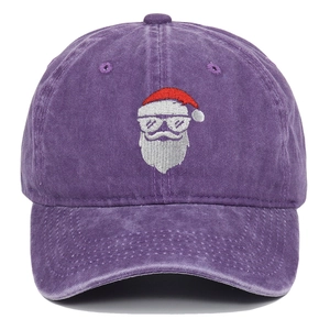 Close-up of Santa Claus embroidery with silver sunglasses on washed purple cotton cap