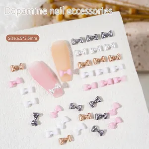 3D mini bow nail art charms in multi-color metallic and resin finishes for nail decoration