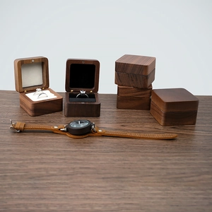 Detailed macro view of premium walnut wood jewelry box with magnetic closure and soft lining
