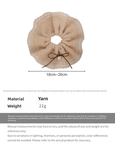 Close-up of beige knit scrunchie with brown bow detail and size 18cm-20cm label
