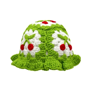 Handmade crochet bucket hat for kids in green and white with 3D red cherry accents