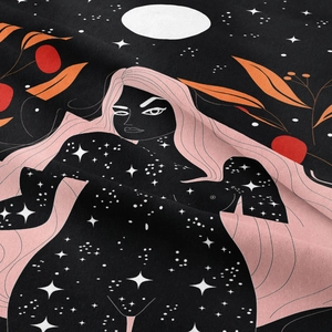 Close-up of bohemian wall tapestry showing soft pink hair silhouette and starry star patterns