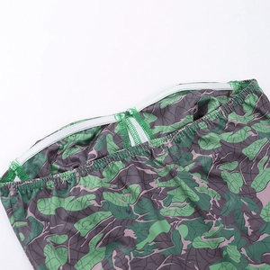 Detail of waist elastic band and stitching on the floral camouflage crop top