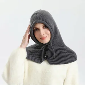 Grey ribbed knit balaclava hat with button closure for winter warmth and fashion