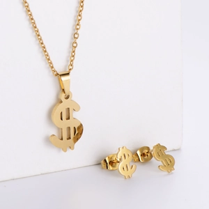 Detailed view of a gold dollar sign necklace and matching stud earrings jewelry set
