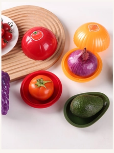 Detailed overhead shot of fruit and vegetable shaped storage containers for food freshness