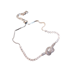 Elegant rose gold knot bracelet with zircon pavé and adjustable sliding closure