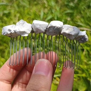 Detail of natural white crystal stones hand-wired on a silver metal 20-tooth hair comb