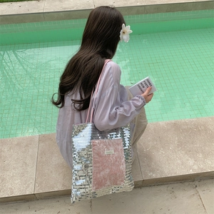 Glitter sequin tote bag with velvet pocket shown in a lifestyle poolside setting