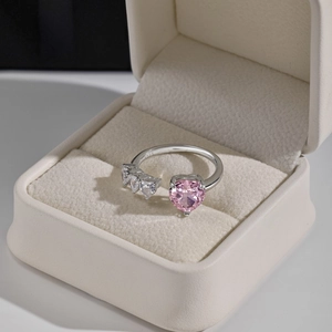 Detailed macro view of S925 sterling silver ring with pink heart stone in a gift box