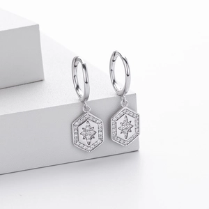 Detail of S925 silver hexagonal star huggie earrings with micro-set zircon crystals