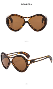 Detailed front and side views of demi-tea oversized sunglasses with cutout temple design