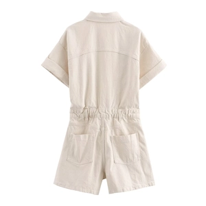 Detail view of beige twill cotton romper back featuring elastic waist and large patch pockets