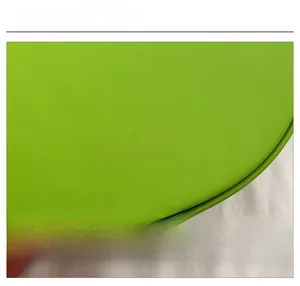 Detail view of the vibrant green leather saddle bag with Fashion & Bags embossed texture