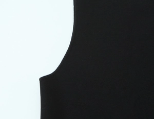 Close-up of seamless stitching and elastic knit fabric texture on a black tank top