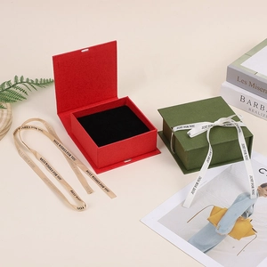 Elegant red and dark green flip jewelry gift box with velvet lining and satin ribbons