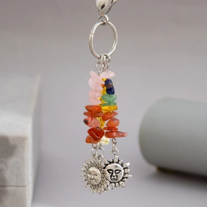 Close-up of bohemian star moon sun keychain with colorful turquoise and alloy charms