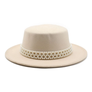 Close-up of pearl bead mesh headband on a beige wool felt flat top boater hat