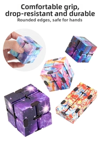 Detail view of Infinity Cube fidget toy with colorful galaxy and tie-dye patterns