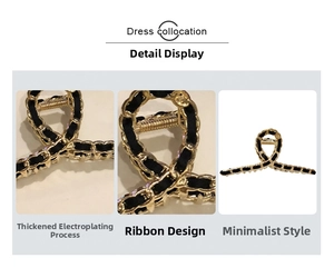 Detail of elegant gold-plated alloy hair claw clip with black ribbon weaving design