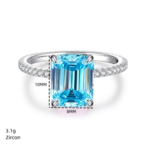 Detailed macro view of 10x8mm emerald-cut blue zircon stone on 925 silver ring band