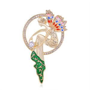 Detailed close-up of wings and figure brooch with colorful enamel and inlaid rhinestones