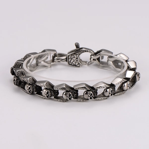 Vintage stainless steel skull link bracelet with an antique silver finish and lobster clasp