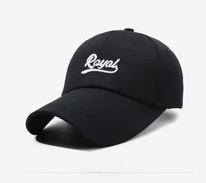 Detail view of black cotton baseball cap with white 3D embroidered Royal lettering