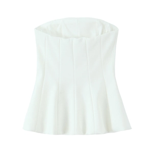 Detailed flat lay of a white strapless bustier top with vertical seam design and flare hem