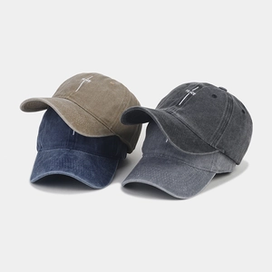 Detail showing PEACE embroidery on four colors of washed cotton vintage baseball caps