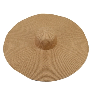 Oversized straw sun hat with wide brim for UV protection and summer beach vacation style