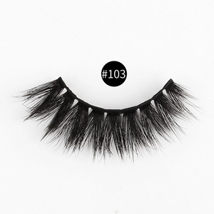 Close-up of thick 3D faux mink eyelashes style #103 on a clean white background