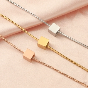 Three minimalist titanium steel box chain necklaces with square pendants in gold and silver