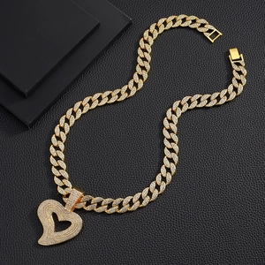 Hip hop style gold plated Cuban link necklace with iced out heart pendant on black leather