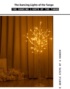 Close-up of LED birch tree lamp with warm lights and realistic white bark texture