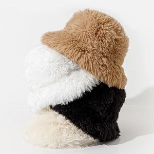 Thick fuzzy faux fur bucket hats in brown, white, and black for winter warmth