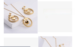 Detailed view of gold plated titanium steel jewelry set with rope textured heart pendants